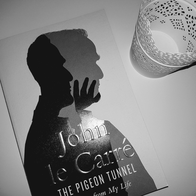 john le carre book in black and white on desk